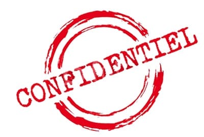 un tampon rouge sur lequel est inscrit le mot "Confidentiel"